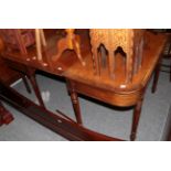 A dining table, in the manner of Gillows, circa 1815 with one additional leaf, on turned and