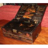 An Oriental chinoiserie lacquered travelling writing slope