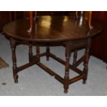 A 19th century oak drop leaf dining table, 139cm (open) by 108cm by 74cm high