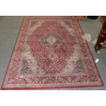 A machine made rug of Oriental design, together with another similar, 188cm by 151cm (2)