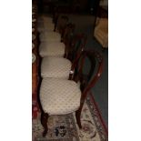 A set of four Victorian mahogany balloon-back dining chairs and two further pairs of similar chairs,