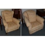 A wing chair upholstered in gold and cream fabric; together with a further armchair in matching