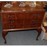 A 1920's three drawer canteen table, 84cm by 54cm by 85cm high, containing a mixture of King's