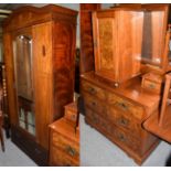 A group of furniture comprising an Edwardian inlaid mahogany mirror-fronted wardrobe; a walnut