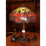 A Tiffany style table lamp decorated with dragonflies