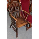 A 19th century elm Windsor armchair