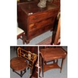 A mahogany chest of drawers, the rectangular top hinged and above a dummy drawer, over two long