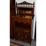 A 19th century parcel gilt mahogany cabinet, the superstructure with arched pediment above a shelf