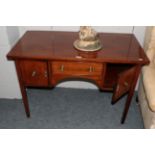 A small 19th century mahogany side table, the rectangular top over a central short drawer, flanked