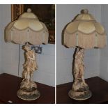 A pair of blush ivory figural table lamps