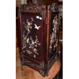 A Japanese Meiji period ivory inlaid two-fold screen, decorated with birds amongst boughs, each