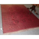 An Afghan Turkmen carpet, the field of quartered guls enclosed by multiple borders, 260cm by