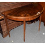 A 19th century crossbanded mahogany demi lune table, 110cm by 56cm by 73cm high