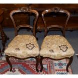 A pair of Victorian balloon-back dining chairs