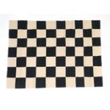Hand-woven Modernist flatweave, the ink black and cream field of chequer-board design, 232cm by