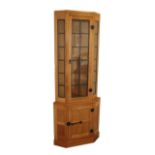 Workshop of Robert Mouseman Thompson (Kilburn): An English Oak Corner Display Cupboard, post 1960's,