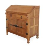 Workshop of Robert Mouseman Thompson (Kilburn): An English Oak Bureau, post 1960's, with fall