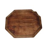 Workshop of Robert Mouseman Thompson (Kilburn): An English Oak Bread Board of canted rectangular