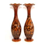 A Pair of Linthorpe Pottery Vases, shape 1464, decorated by Fred Brown with bullrushes and flowers