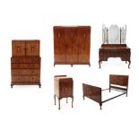An Exceptional Art Deco Five Piece Figured Walnut and Amboyna Burl Bedroom Suite, inlaid with floral