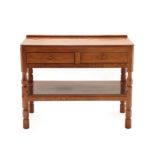 Workshop of Robert Mouseman Thompson (Kilburn): An English Oak Serving Table, with raised upstand,