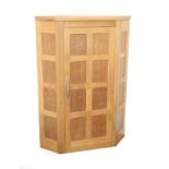 Workshop of Robert Mouseman Thompson (Kilburn): An English Oak Panelled Hanging Corner Cupboard,