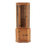 Workshop of Robert Mouseman Thompson (Kilburn): An English Oak Corner Display Cupboard, post 1960's,