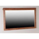 Workshop of Robert Mouseman Thompson (Kilburn): An English Oak Landscape Wall Mirror, with penny