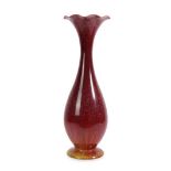 A Tall Linthorpe Pottery Vase, shape 1601, with frilled rim in red glaze, impressed factory marks