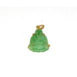 A jade pendant depicting a seated Buddha, length 3.0cm . Loop indistinctly marked. Gross weight 4.
