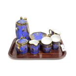 A Noritake coffee set, the matte blue ground with panels of flowers and gilt decoration