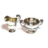 An Edward VII silver cream jug and sugar-bowl, the first by Jackson and Fullerton, London, dated