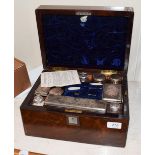 A 19th century silver plate mounted dressing table service in rosewood case