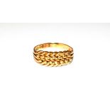 An 18 carat gold ring, finger size T. Gross weight 6.7 grams.
