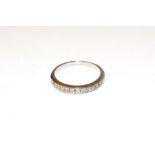 A diamond half hoop ring, two rows of eight-cut diamonds in white claw settings, to a plain polished