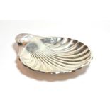 An Edward VII silver shell shaped dish, by Henry Atkin, Sheffield, 1908, on three ball feet 24.5cm