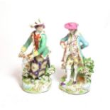 A pair of 19th century Derby figures with hounds
