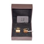 A pair of cufflinks, stamped '750', retailed by Dunhill. Gross weight 11.5 grams.