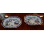 A pair of 19th century Chinese export serving dishes each painted with a figure on a boat, next to a