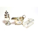 An Edward VII silver caster, Birmingham, 1902; a sauce boat, Birmingham, 1900 and a seven-bar