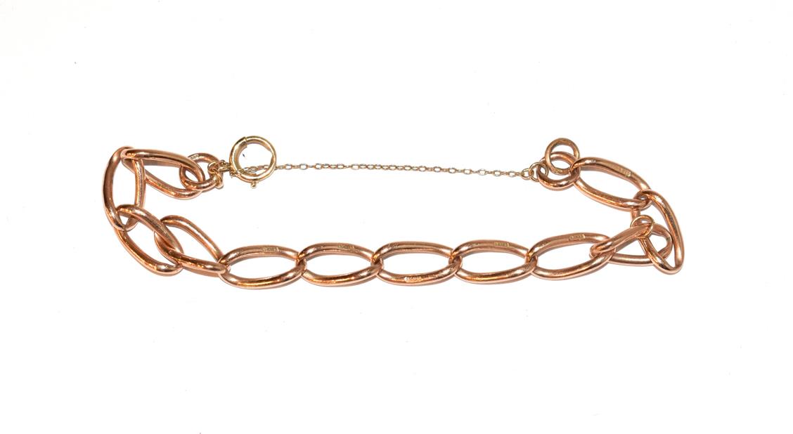 A curb link bracelet, each link stamped '9' and '.375', length 20cm . Gross weight 14.8 grams.