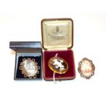 A cameo brooch, frame stamped '9CT' a cameo brooch depicting a lady reading and a cameo brooch