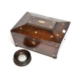 A 19th century rosewood and mother-of-pearl inlaid sarcophagus shape box with a lift out compartment