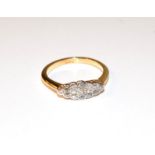 A diamond cluster ring, the old cut diamonds in white claw and rubbed over settings, to a yellow