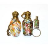 Two gilt metal mounted glass scent bottles, the hinged cover on each stamped with foliage and with