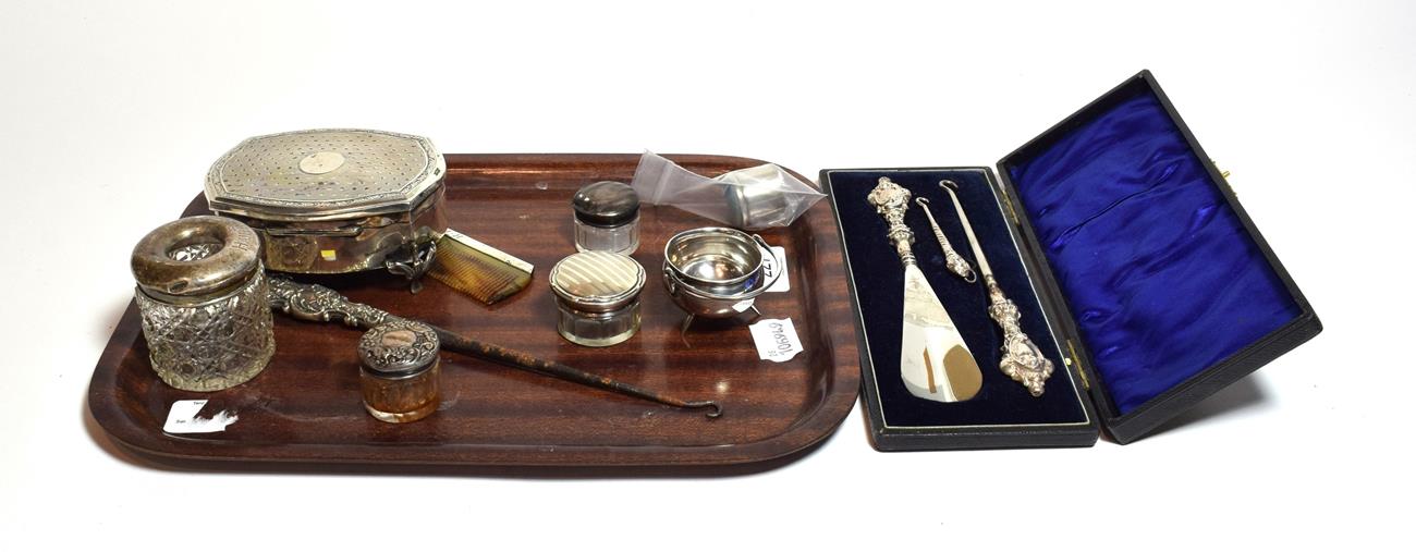 A collection of silver, including an oblong dressing-table box, a cauldron-form salt cellar, four