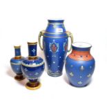 Mettlach vases with deep blue ground, including an example decorated with stylized flowers and