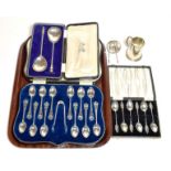 Three cased sets of spoons, together with a silver mug and a silver ashtray (a.f.)