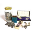 A quantity of pre-1947 Silver GB coins and some later examples, silver pierced book corner mounts, a