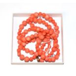 A graduated coral bead necklace, length 96.5cm . Gross weight 114.1 grams. Clasp broken.